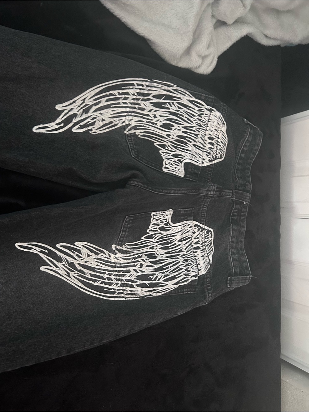 Black Relaxed Men's Jeans with White Wing Print